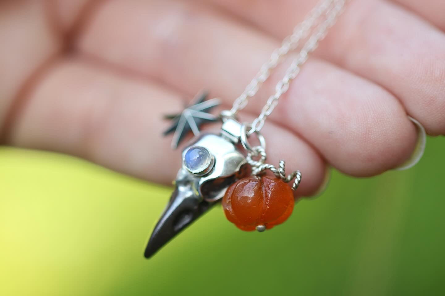 Sterling silver raven, star and carved carnelian pumpkin necklace