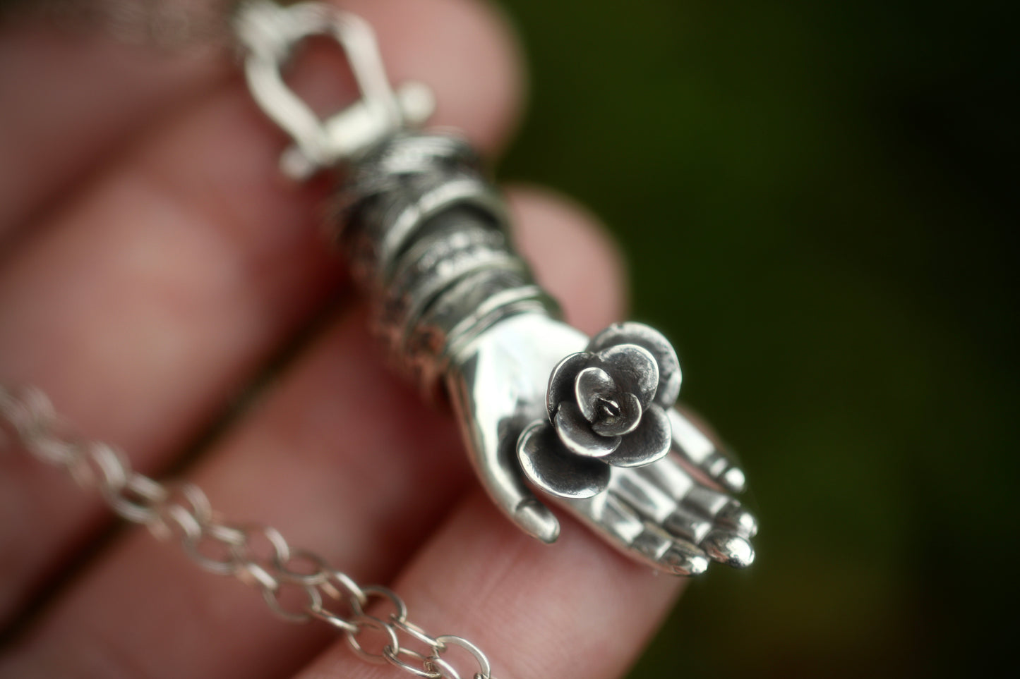 Sterling silver succulent hand necklace